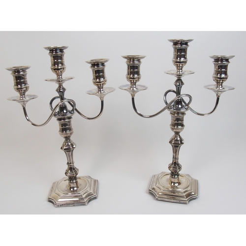 167 - A pair of early 20th Century silver candelabra