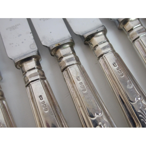 170 - A matched suite of silver cutlery