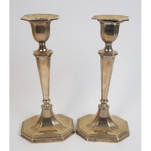 198 - A pair of silver candlesticks