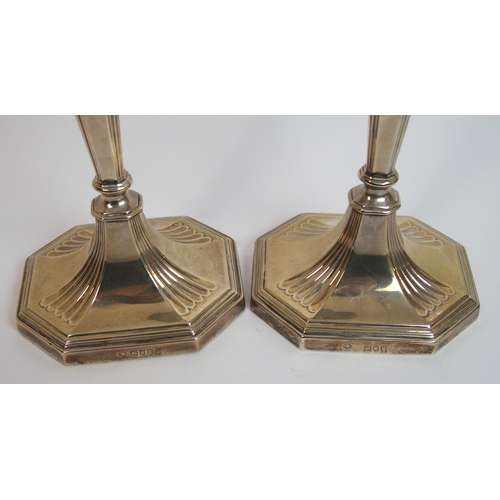 198 - A pair of silver candlesticks