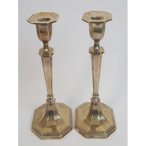 198 - A pair of silver candlesticks