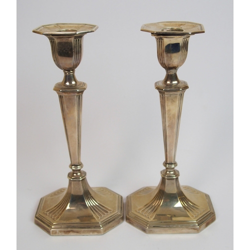 198 - A pair of silver candlesticks