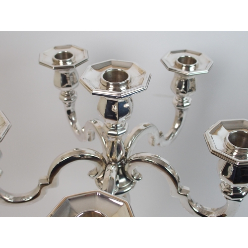 205 - A pair of sterling silver candelabra