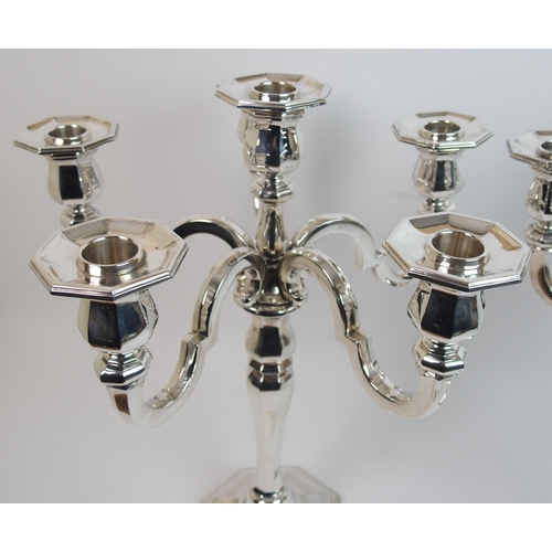 205 - A pair of sterling silver candelabra