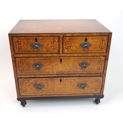 293 - A Victorian walnut and ebony inlaid miniature chest