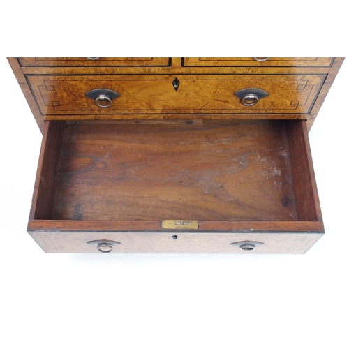 293 - A Victorian walnut and ebony inlaid miniature chest