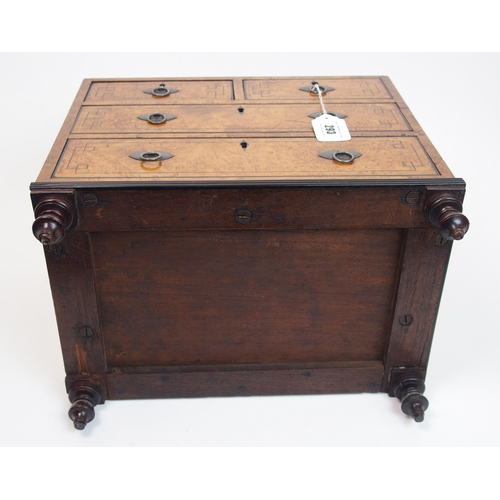 293 - A Victorian walnut and ebony inlaid miniature chest