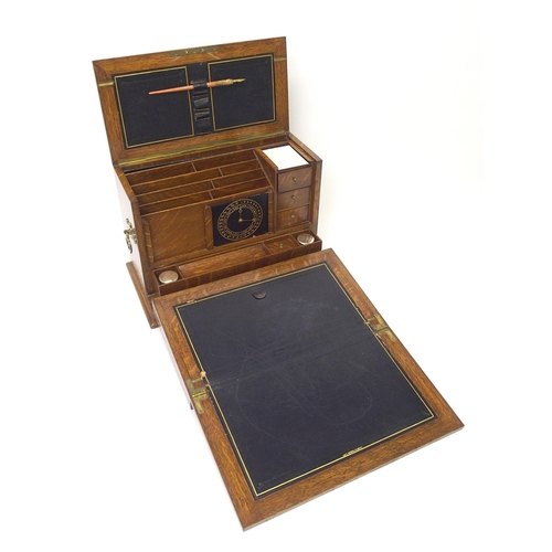 301 - A Victorian stained oak stationery box and writing slope