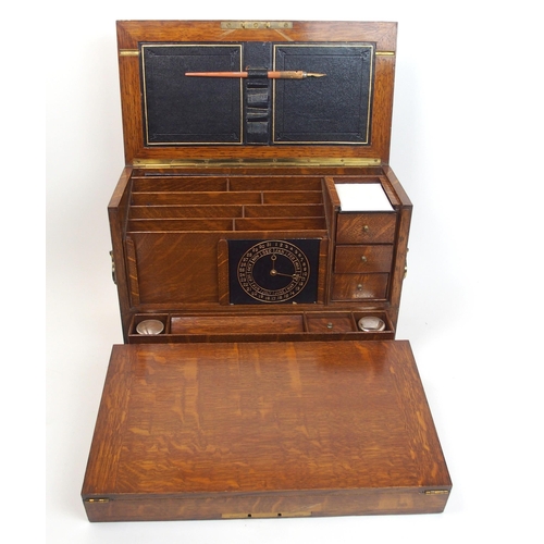 301 - A Victorian stained oak stationery box and writing slope