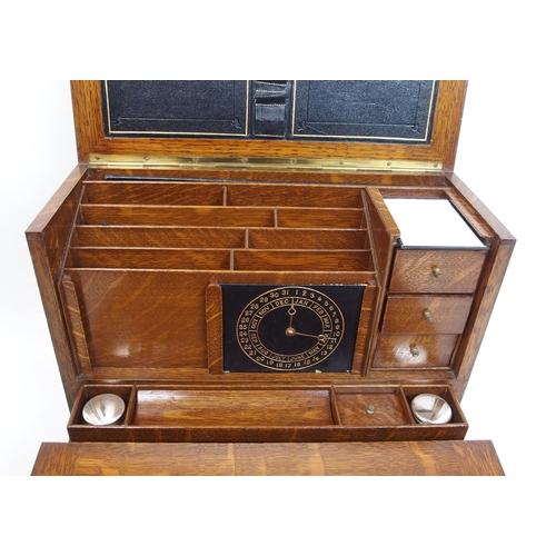 301 - A Victorian stained oak stationery box and writing slope