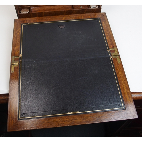 301 - A Victorian stained oak stationery box and writing slope