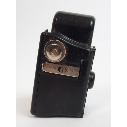 321 - A Bakelite cased Midget Coronet camera