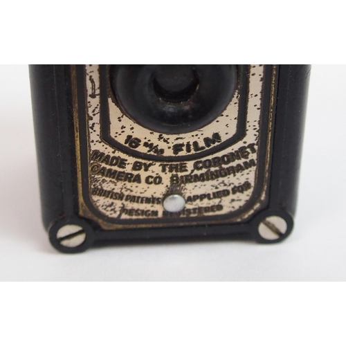 321 - A Bakelite cased Midget Coronet camera