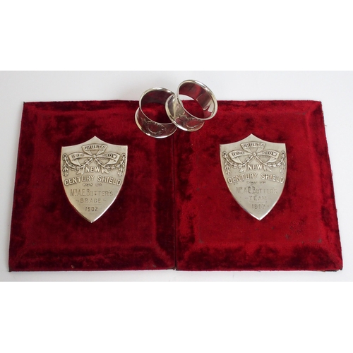 323 - Two white-metal Cruft's Dog Show shield-shaped plaques