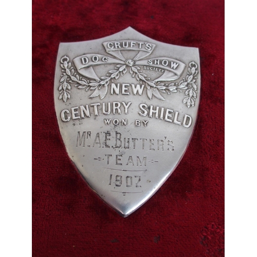 323 - Two white-metal Cruft's Dog Show shield-shaped plaques