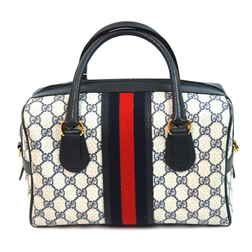 326 - A Gucci handbag with leather carrying handles