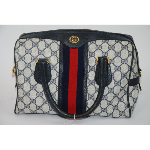 326 - A Gucci handbag with leather carrying handles