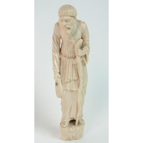 329 - A Continental ivory figure of an old gentleman