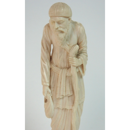 329 - A Continental ivory figure of an old gentleman