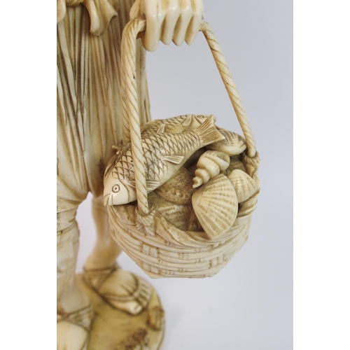 49 - A large Japanese sectional ivory figure of a fisherman