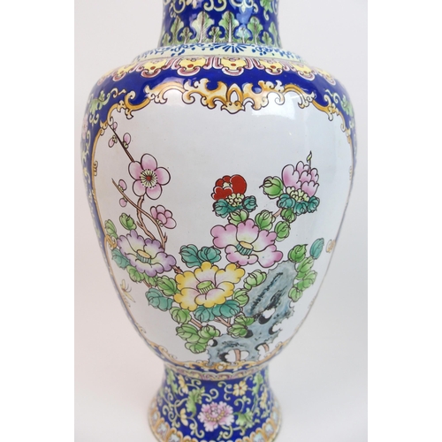 69 - A Persian enamel and copper baluster vase