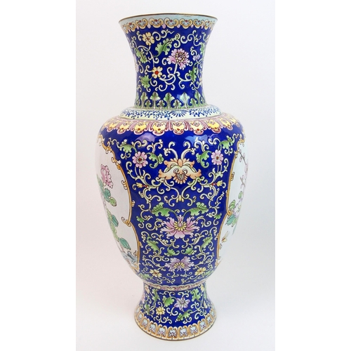 69 - A Persian enamel and copper baluster vase