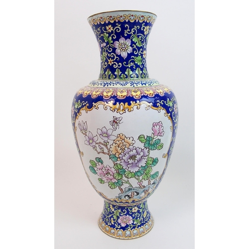 69 - A Persian enamel and copper baluster vase