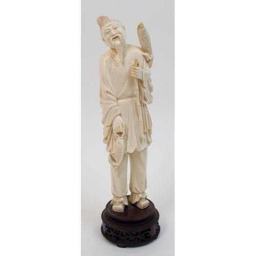 7 - A Chinese ivory model of a fisherman