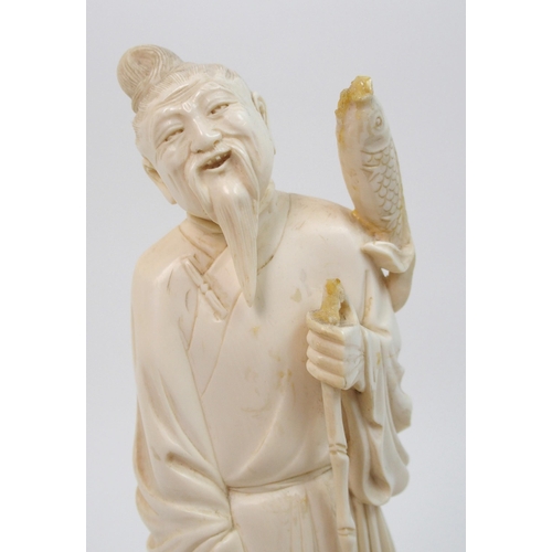 7 - A Chinese ivory model of a fisherman