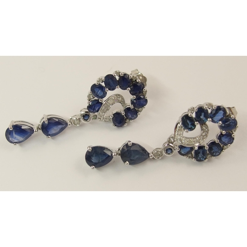 779 - A pair of 14ct white gold diamond and sapphire earrings