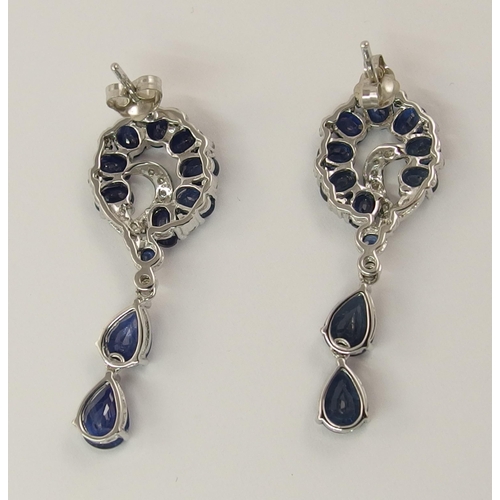 779 - A pair of 14ct white gold diamond and sapphire earrings