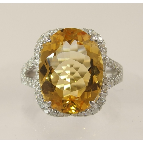 787 - *WITHDRAWN* An 18ct white gold yellow sapphire and diamond ring