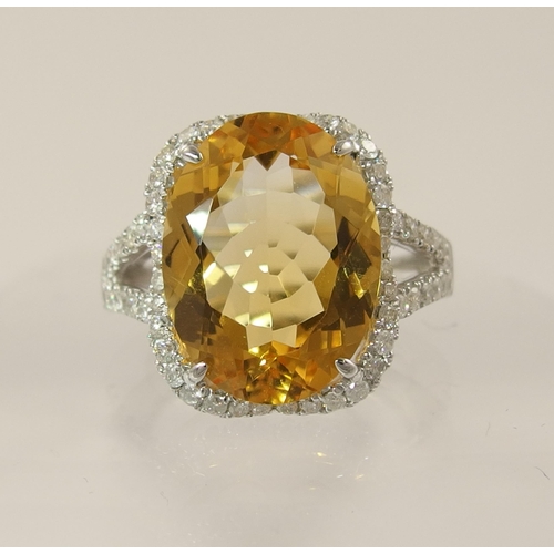 787 - *WITHDRAWN* An 18ct white gold yellow sapphire and diamond ring