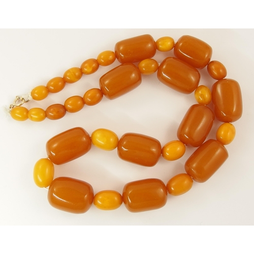 788 - A string of amber coloured beads