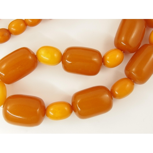 788 - A string of amber coloured beads