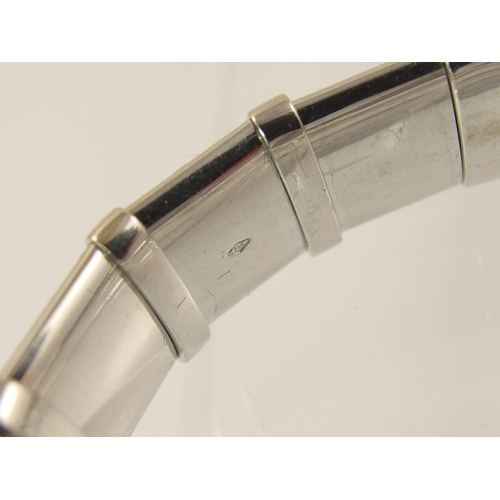 792 - An 18ct white gold diamond set bangle