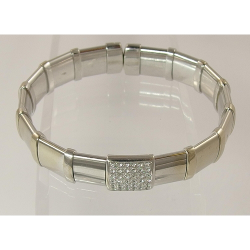 792 - An 18ct white gold diamond set bangle