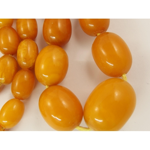 793 - A collection of amber coloured beads and bracelets