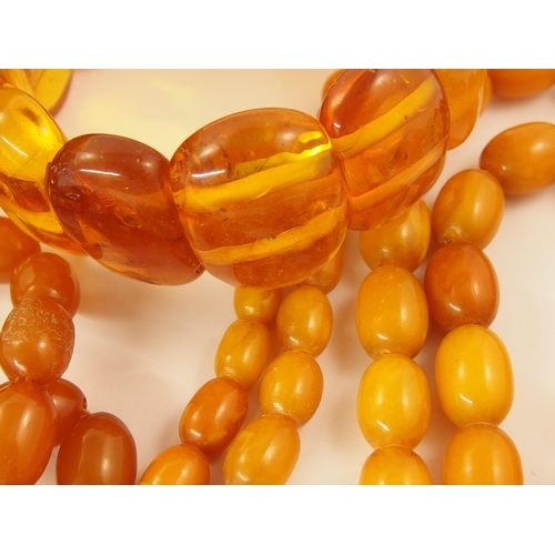 793 - A collection of amber coloured beads and bracelets