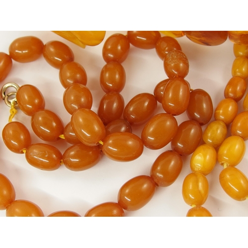 793 - A collection of amber coloured beads and bracelets