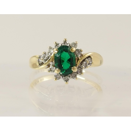 795 - An 18ct yellow gold green gem and diamond ring