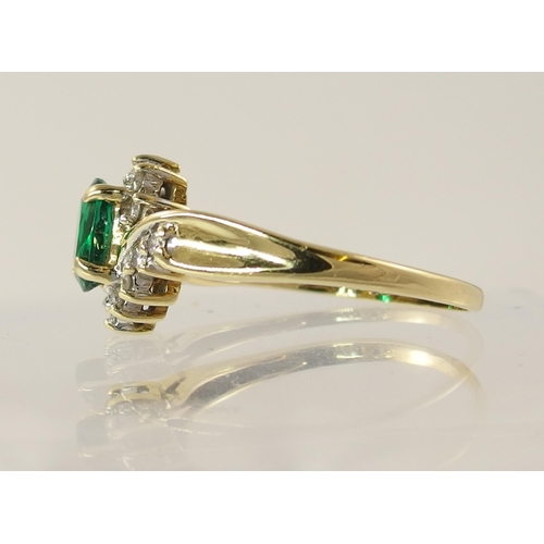 795 - An 18ct yellow gold green gem and diamond ring