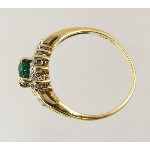 795 - An 18ct yellow gold green gem and diamond ring