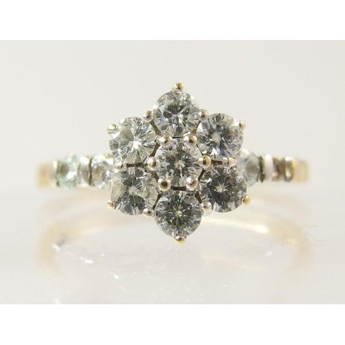 795C - A 14ct gold diamond flower ring of approximately 0.85cts