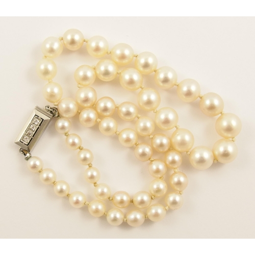 797A - A string of pearls with a diamond set clasp