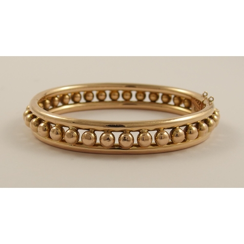 797B - A 15ct rose gold Early 20th century bangle