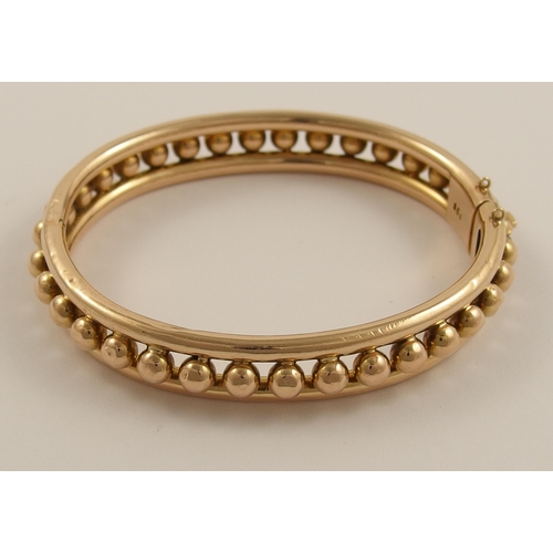 797B - A 15ct rose gold Early 20th century bangle