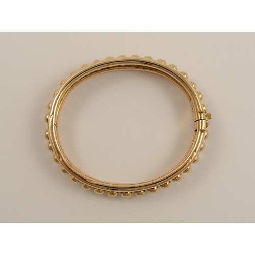 797B - A 15ct rose gold Early 20th century bangle