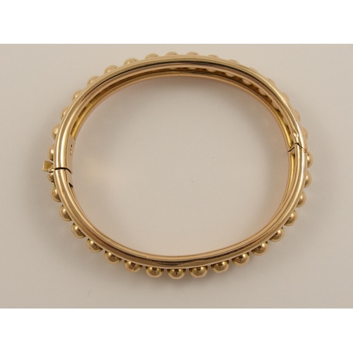 797B - A 15ct rose gold Early 20th century bangle