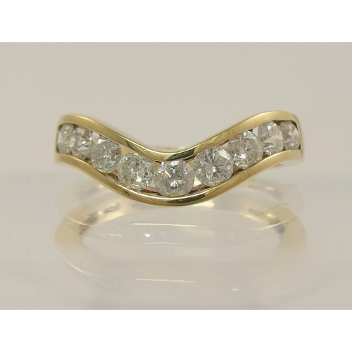 797C - A 9ct gold diamond wave ring